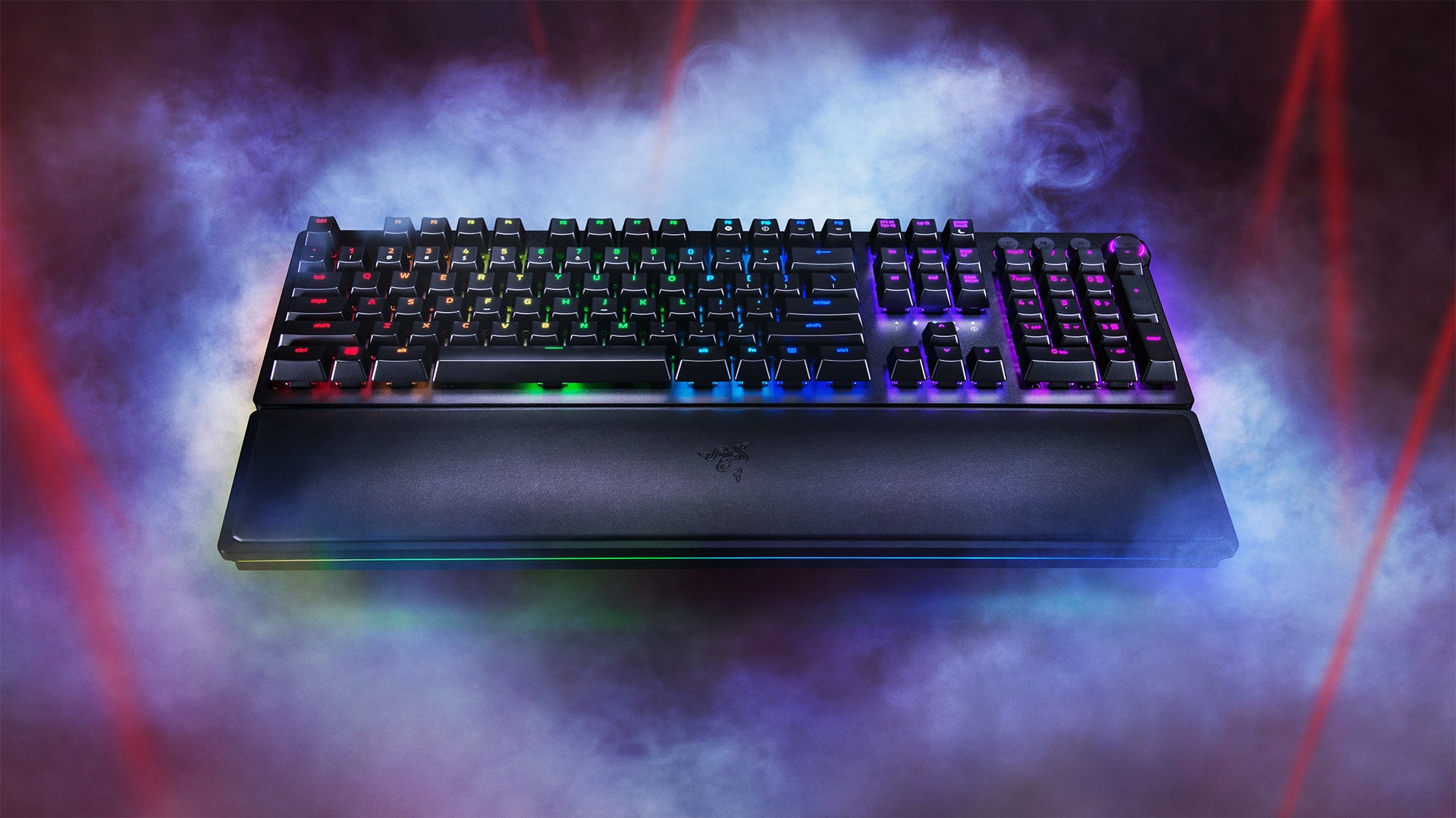 Gaming keyboard with RGB lighting on a smoky background